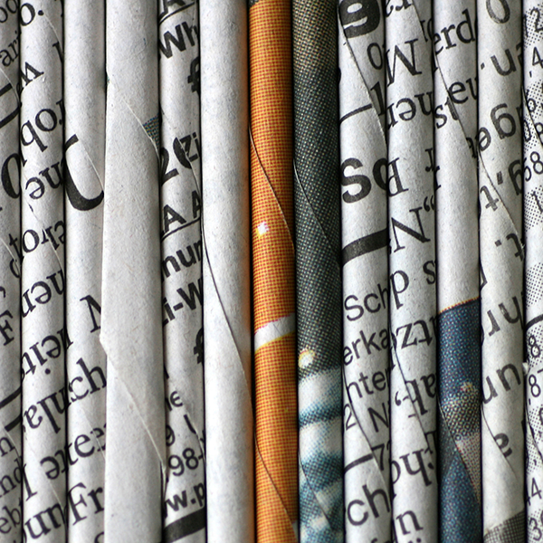 Newspapers folded and stacked horizontally