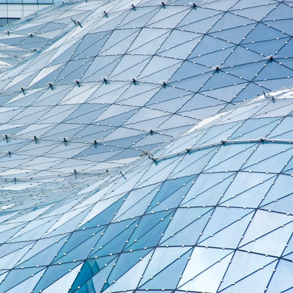 Blue glass windows reflecting sunlight