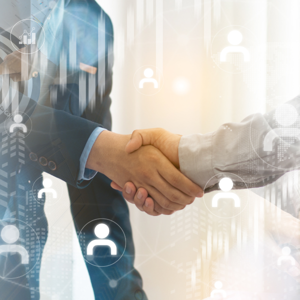 two shaking hands with icons of people floating around