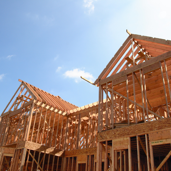 Frame of house being built with sunny day